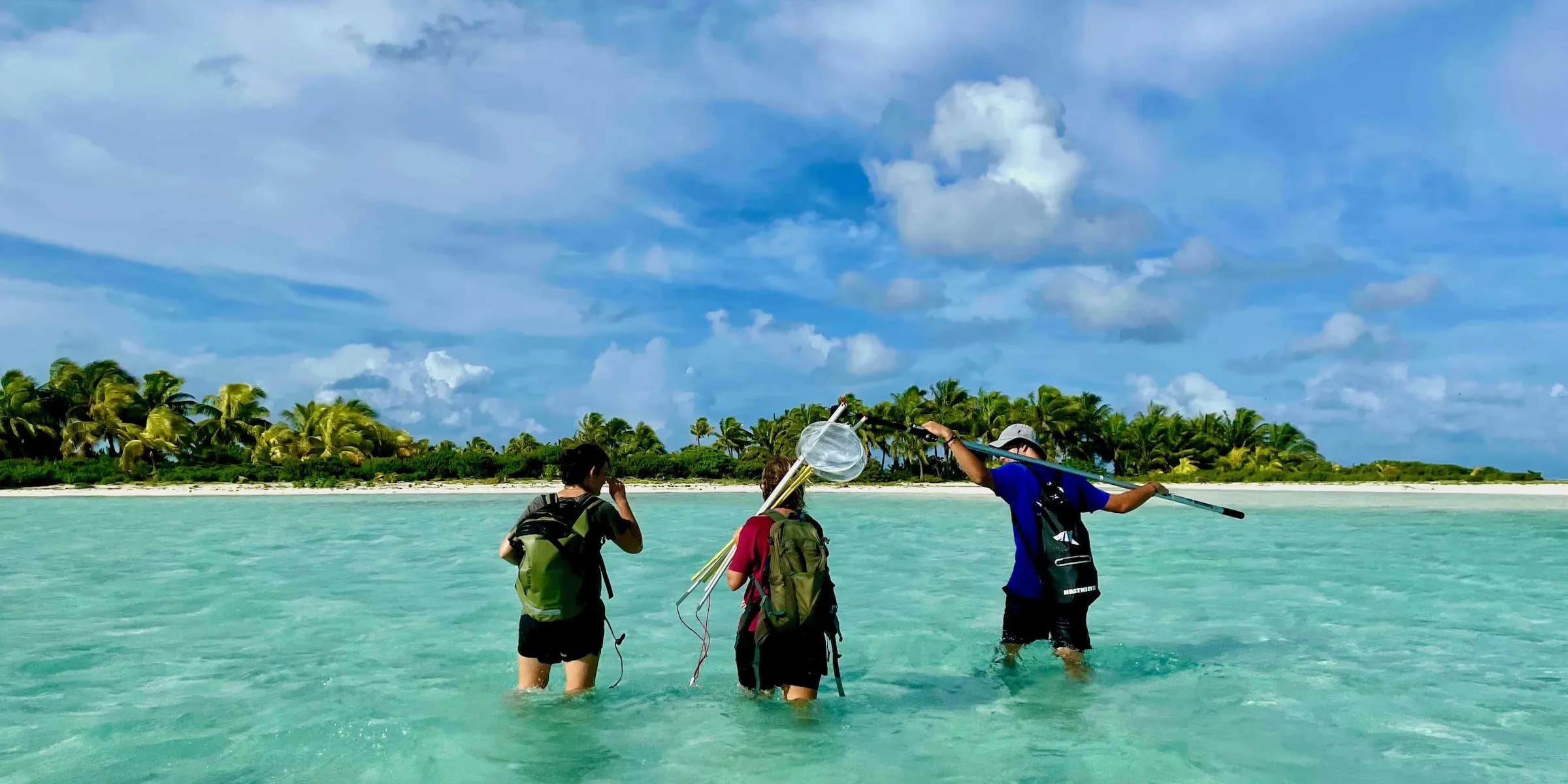 Researchers crossing the lagoon on their way to fieldwork on Tetiaroa