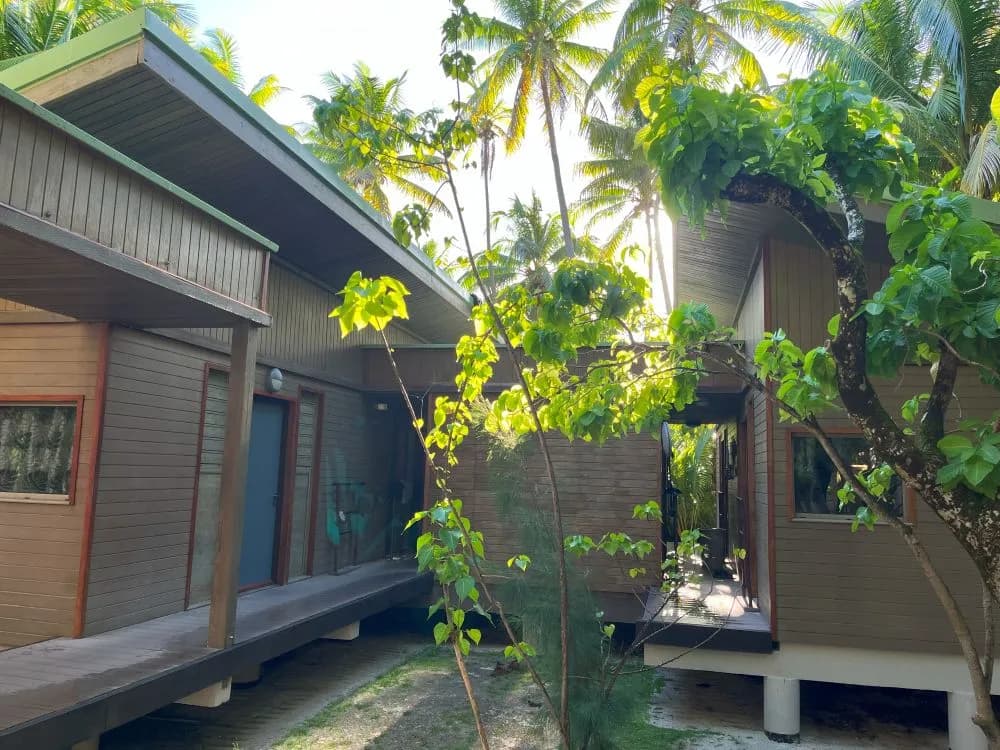 Wooden buildings at the Bailey Field Station among the palms