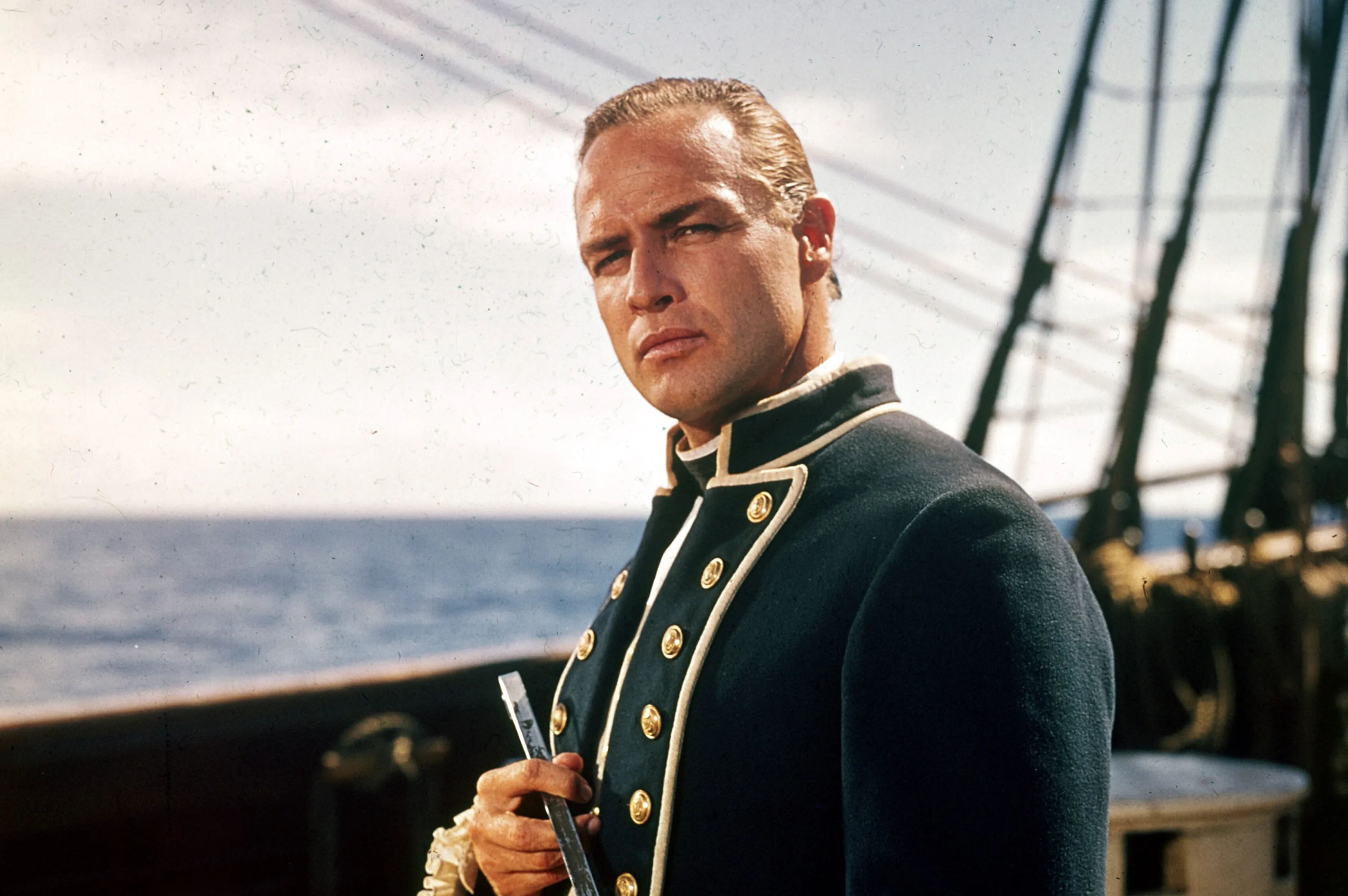 Marlon Brando in costume as Fletcher Christian aboard the Bounty during the filming of Mutiny on the Bounty
