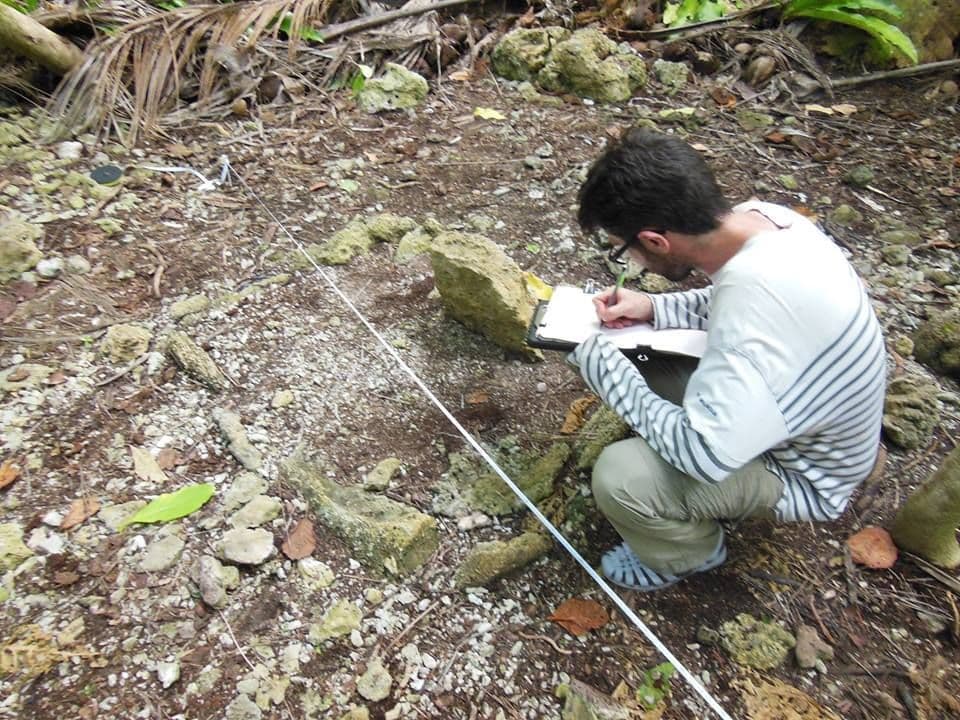 Guillaume Molle mapping a coral cist