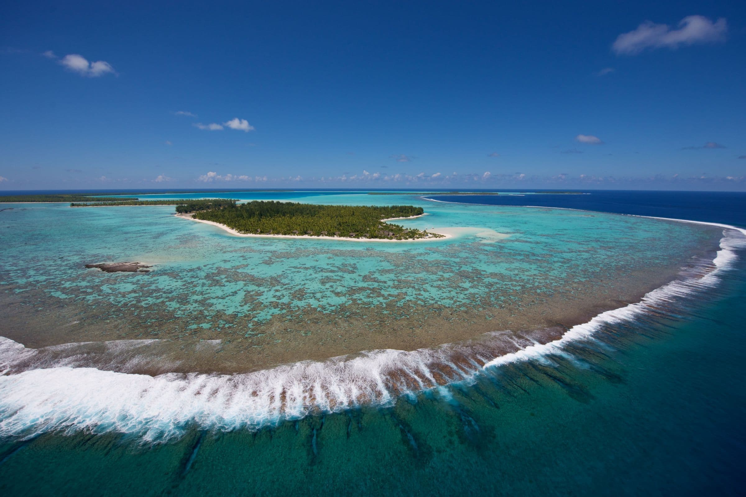waves break on the coral reef